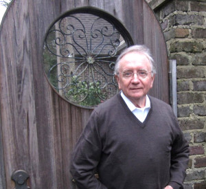 King Tommy, pausing at a garden gate, is a board member and past president of the Birmingham Botanical Gardens will reign as King of the Beaux Arts Krewe Ball 2016.